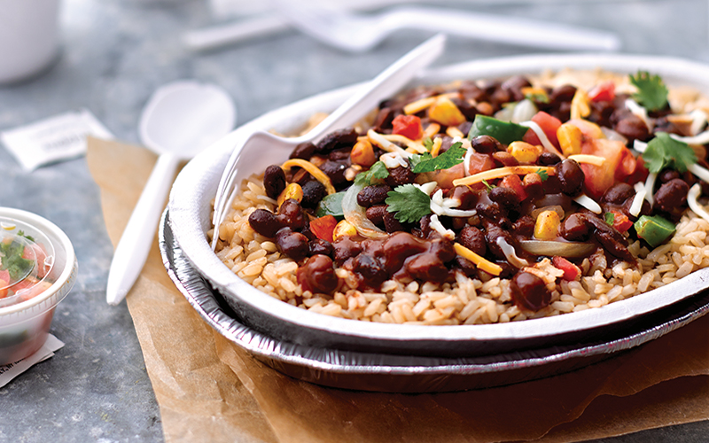 Sauced and seasoned Bush’s Best® Easy Entrées® Taco Fiesta Black Beans kick off this Fiesta Black Bean Rice Bowl foodservice recipe for recreation, C&U, Healthcare, K-12 and commercial restaurant menus.