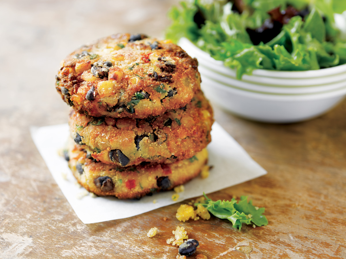 three corn cakes made with Bush’s Best® Black Beans stacked on top of each other